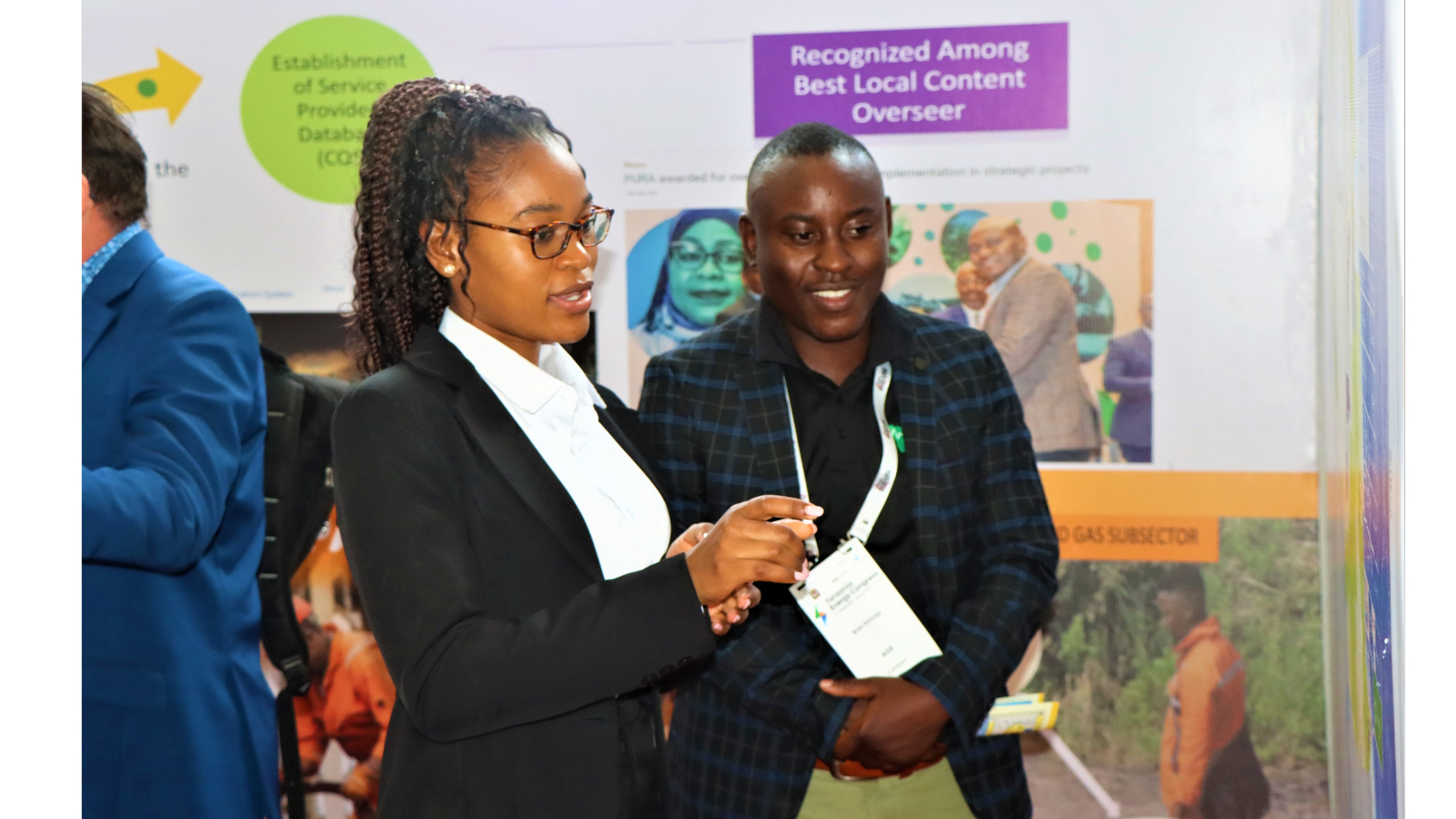 Ms. Robinnancy Mtitu, a Petroleum Engineer from PURA explaining about petroleum upstream operations in the country to one of the congress attendees who visited PURA’s booth at the 4th Oil and Gas Congress held in Dar es Salaam from 03rd to 4th August, 2022